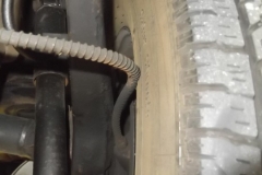 102 parking brake cable rubbing tire