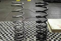 319 front coil springs being blasted to remove coating