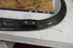 181 rear bow strap retainer is riveted in