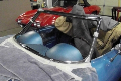 283 car is masked with soft clothes and windshield trim is pre fit to frame