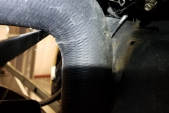 125 alternator belt is very close to radiator hose