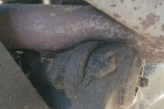 126 aftermarket header is dented in to allow clearance to idler arm