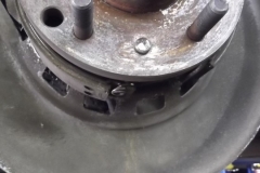 154 RR parking brake spring was broken and hanging out digging into rotor