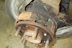 111 LR rotor removed, rivets drilled, old parking brake hardware
