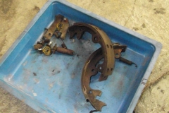 112 parking brake hardware removed - note the seized and rusted adjuster, broken upper spring