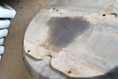 101 spare tire tub top wet from apparent fuel