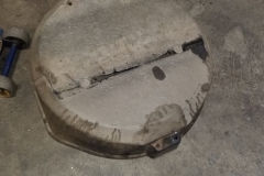 149 top of spare tire tub shows evidence of fuel leaking