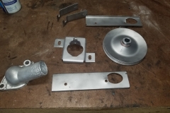 869 door handle reinforcement, thermostat housing, PS pulley, column mounted all blasted and ready for primer