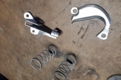 877 hood pin springs, steering pump guide bracket, and park brake pulley bracket blasted
