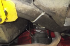 233 rubber fuel hose routed under car